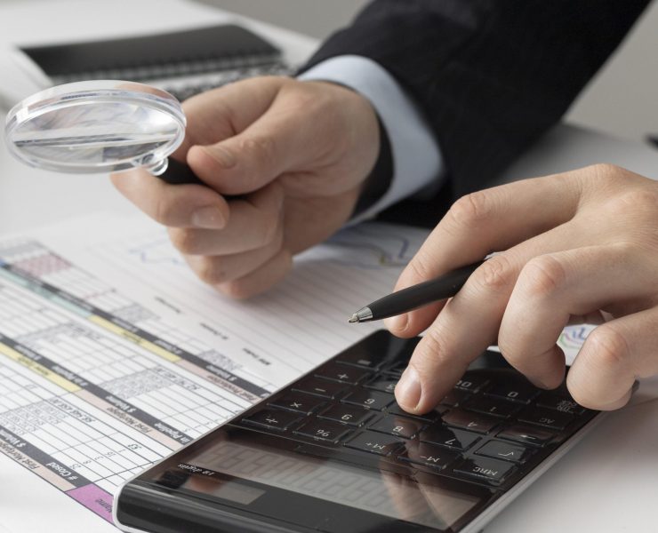 business-man-calculating-finance-numbers business-man-calculating-finance-numbers